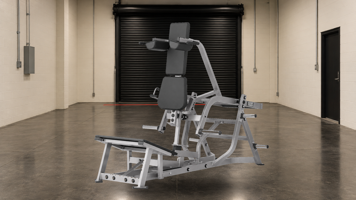 Hammer Strength V Squat on a commercial receiving bay floor, ready for freight shipping and installation